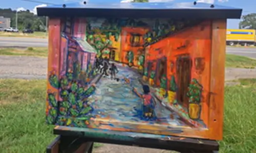 Seis Puentes Neighborhood Bookshelf with dream inspired art and families selecting books.